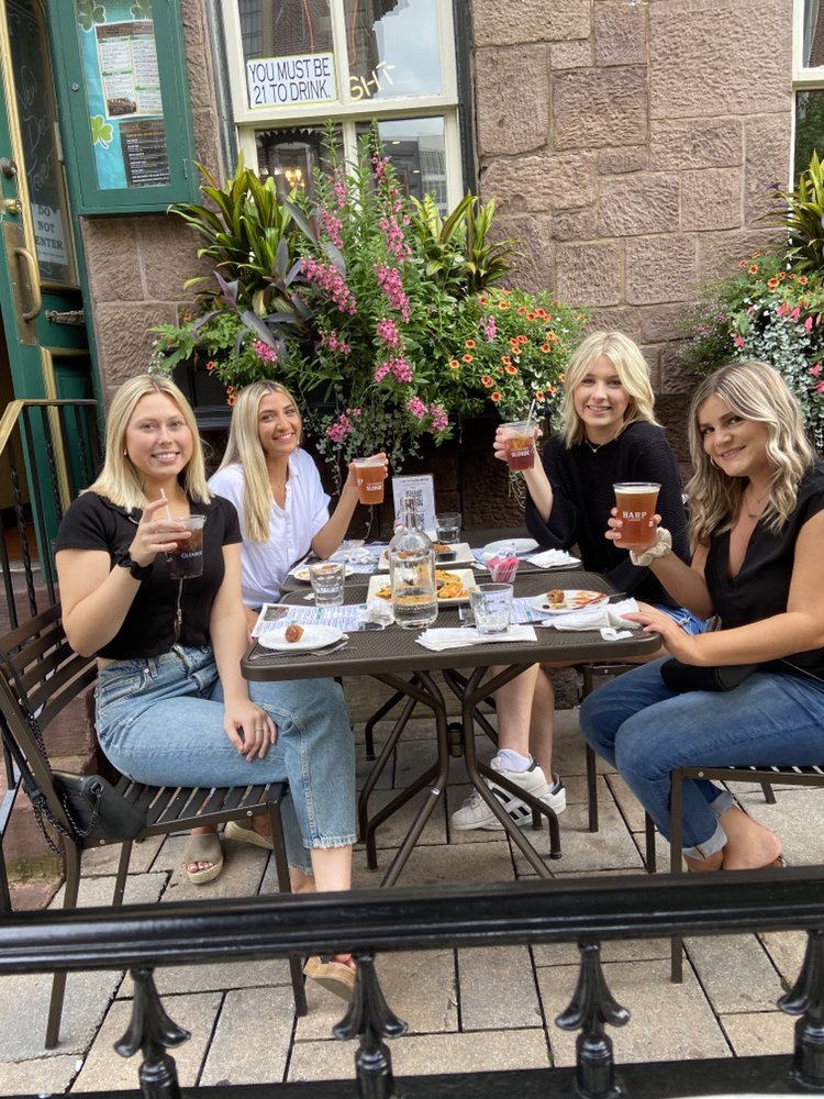 Enjoying some drinks on the patio of the New Deck Tavern